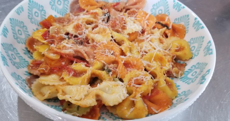 Multi-colored pasta with a fresh Greek style tomato sauce